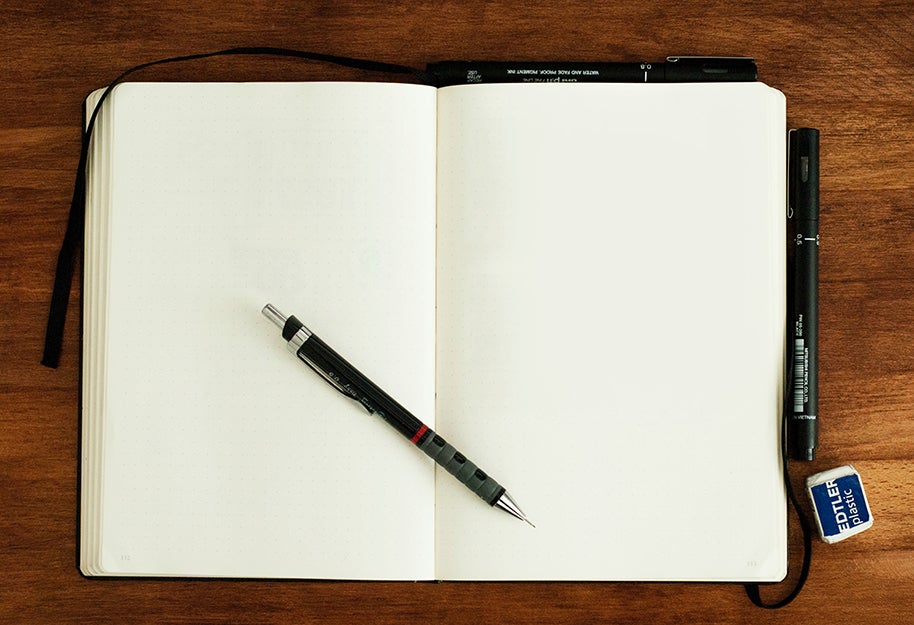 notebook with a pencil on top