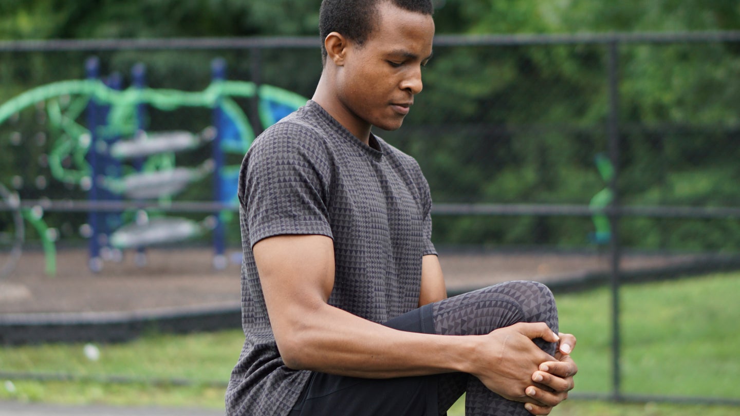 a man stretching out and warming up before exercise