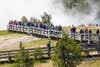 people crowded on walkways at geysers in yellowstone
