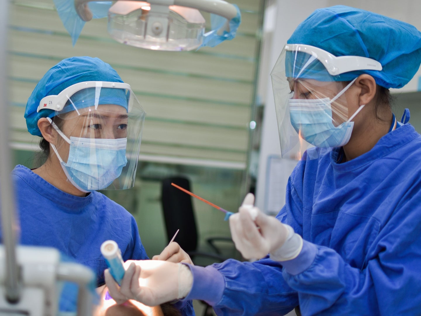 dentists working with full PPE