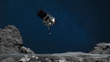 The spacecraft OSIRIS-REx in the sky over a rendering of the ground on asteroid Bennu
