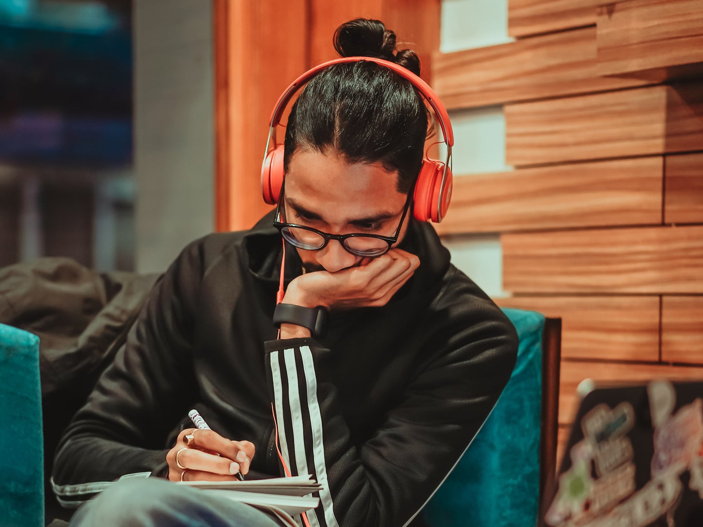 a man with headphones listening to podcasts or music