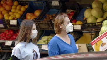 women wearing masks at the grocery store