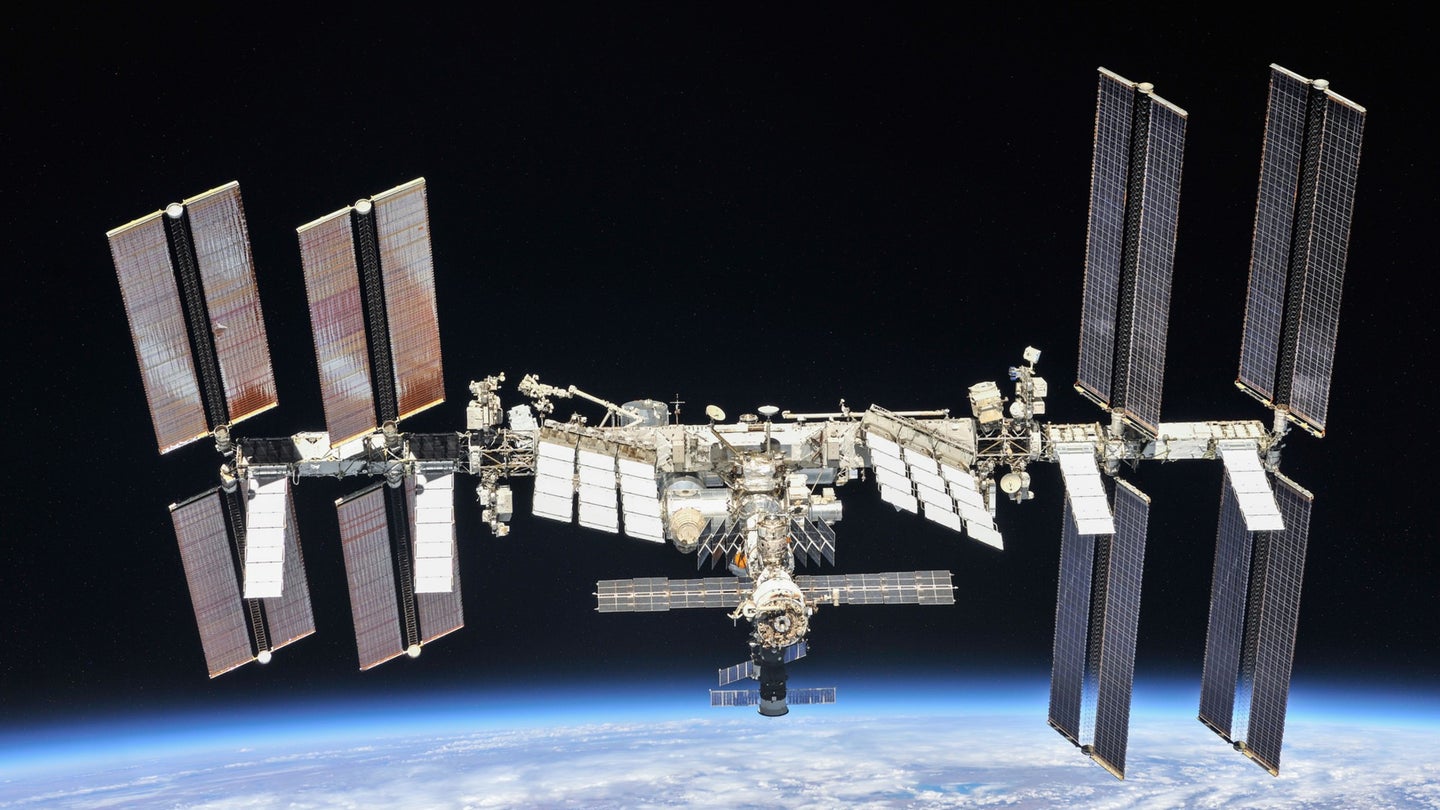 A photograph of the International Space Station floating 250 miles above the Earth.
