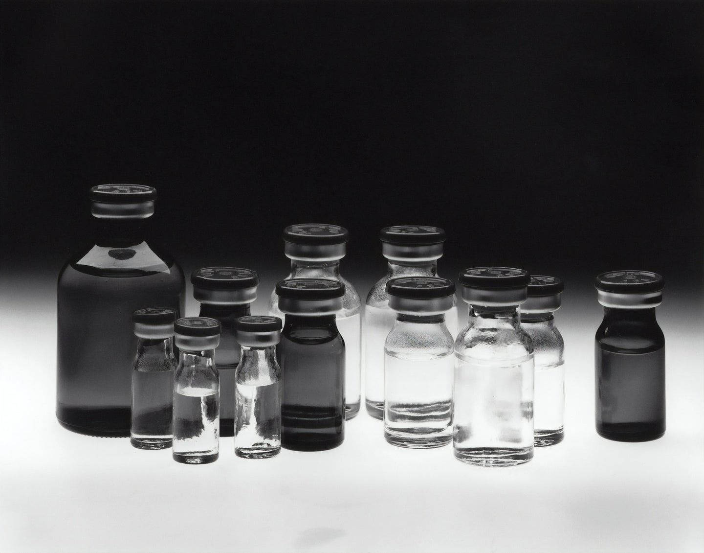 Chemotherapy-drug bottles in black and white
