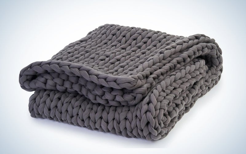 a gray blanket on a white background