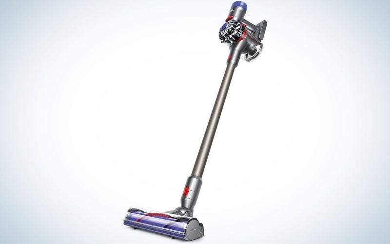 Grey and purple cordless stick vacuum cleaner with battery powered