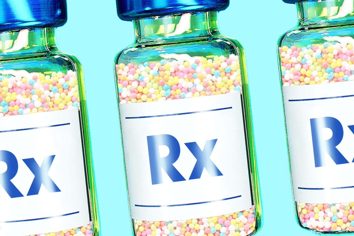 three vaccine bottles with "RX" on their labels, filled with small frozen beads of ice cream