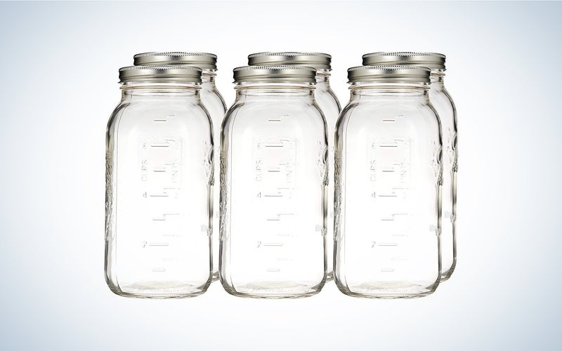 six glass 64-ounce Ball mason jars with metal lids