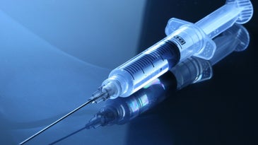 a syringe with a needle attached
