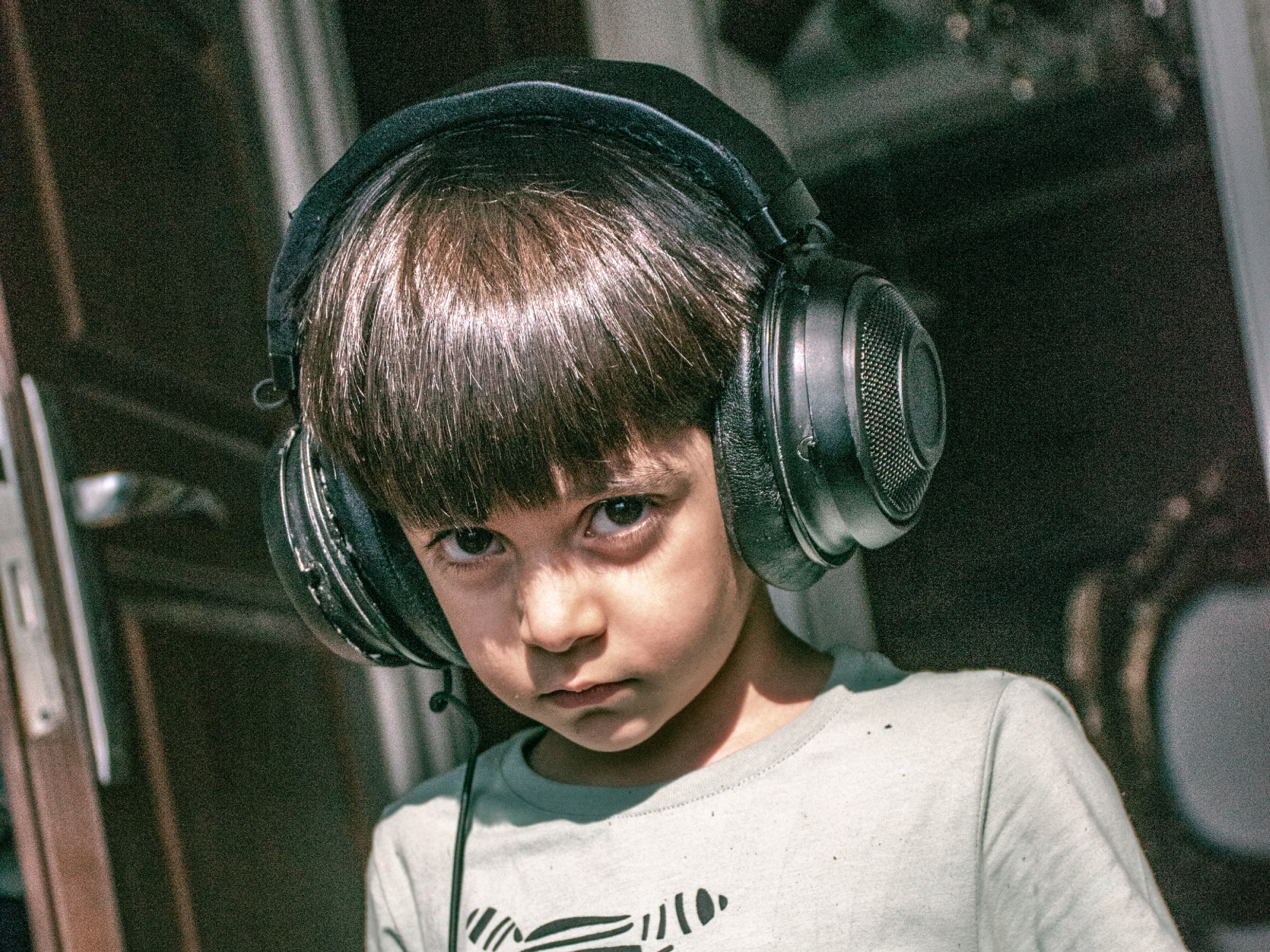 a child wearing large comfortable headphones