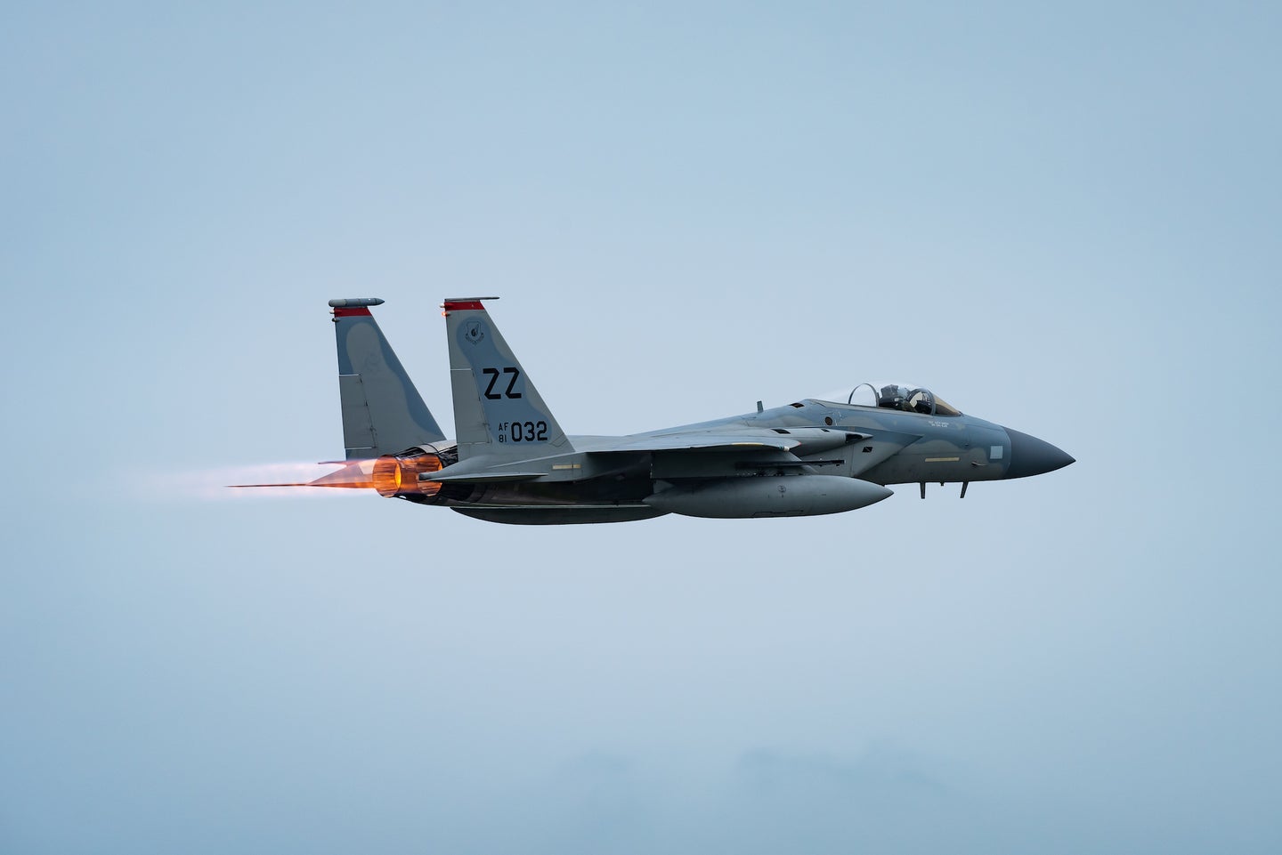 An F-15C Eagle fighter jet takes off.