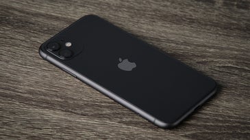 black iPhone on a wood table