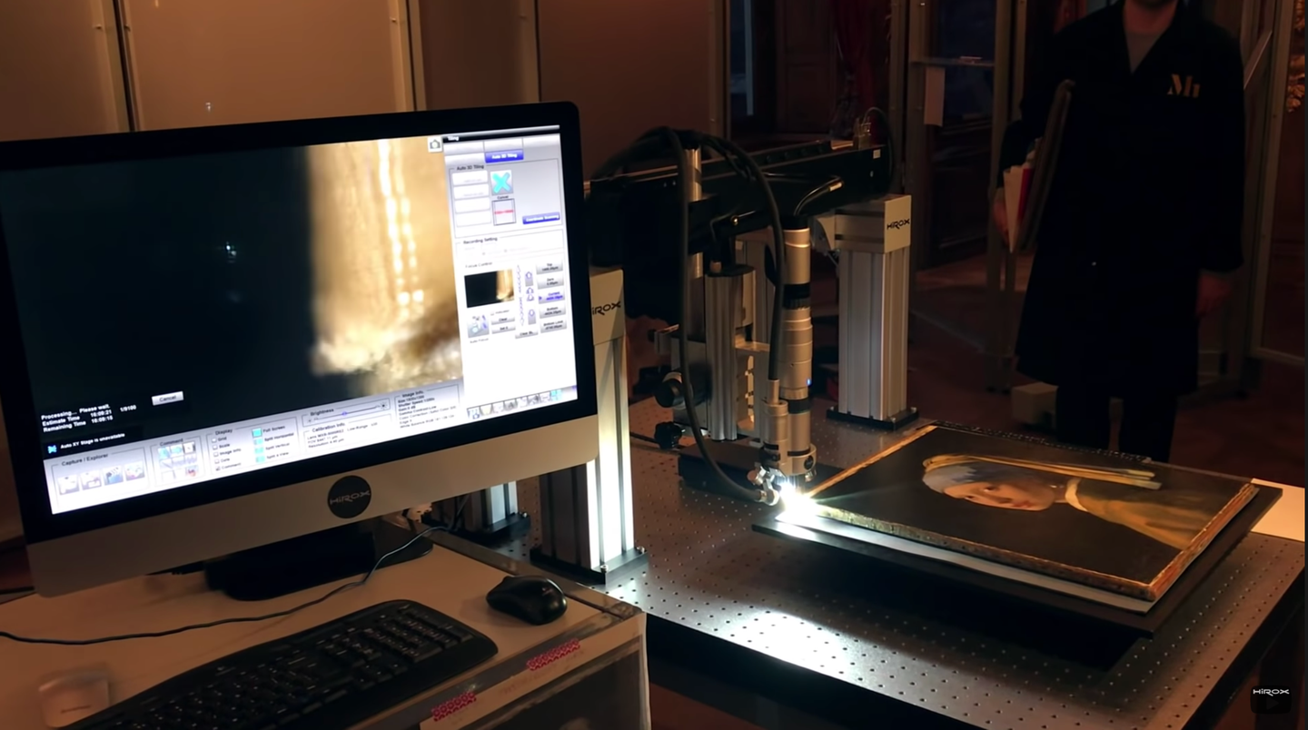 A Hirox digital microscope capturing images of a famous painting.