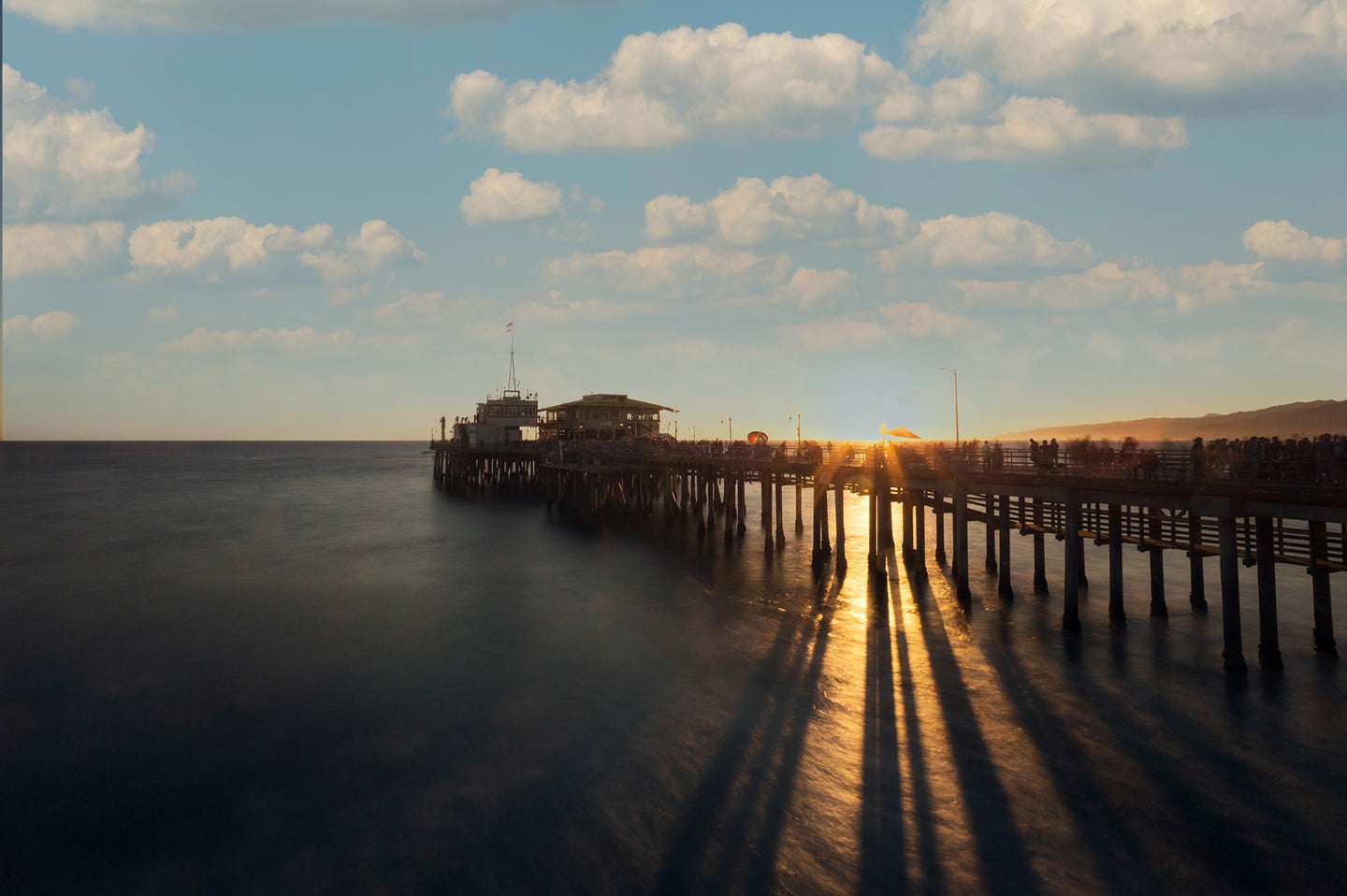 Badly edited photo of a pier during sunset