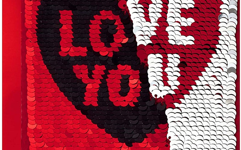 Valentine's day cards with reversible red/black and silver/red sequins that say "I love you" in a heart