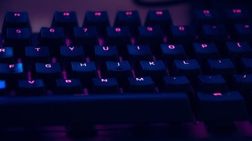 mechanical keyboard with pink and purple lights
