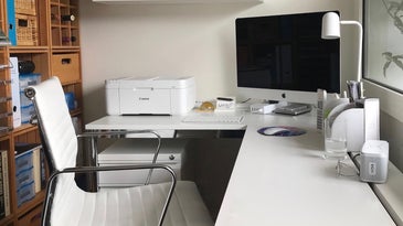 office with a white chair, desk, apple imac, and the best home office printer