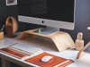 iMac on desk with wooden riser