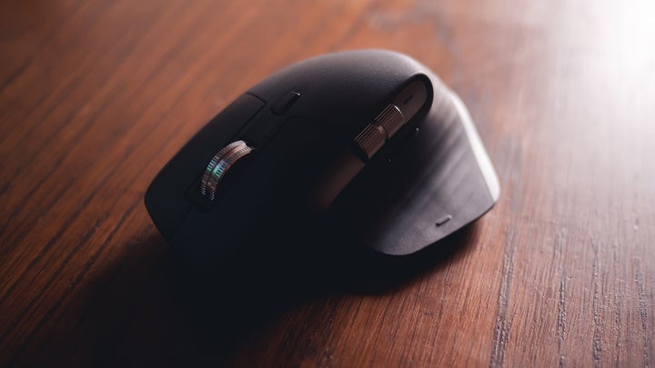 Best ergonomic mouse on a wooden table.
