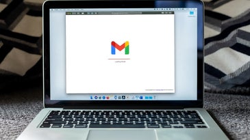 A MacBook displays a loading Gmail icon.