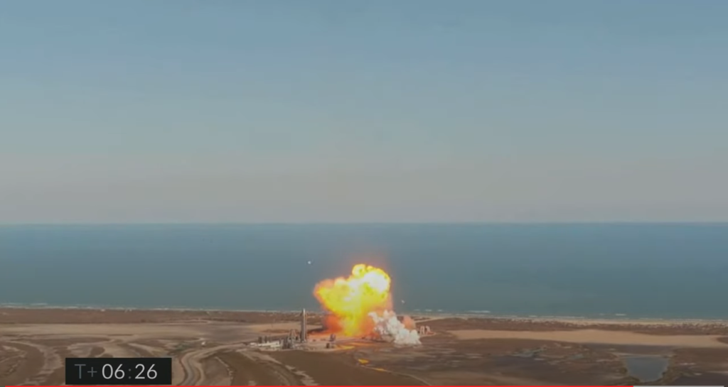A Starship rocket explodes after landing on the launch pad.