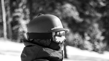 person with a helmet, ski goggles, the best ski mask, and jacket on a mountain