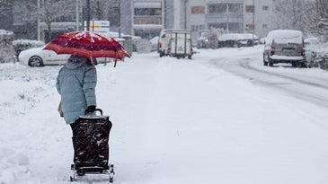 person walking in snowy street
