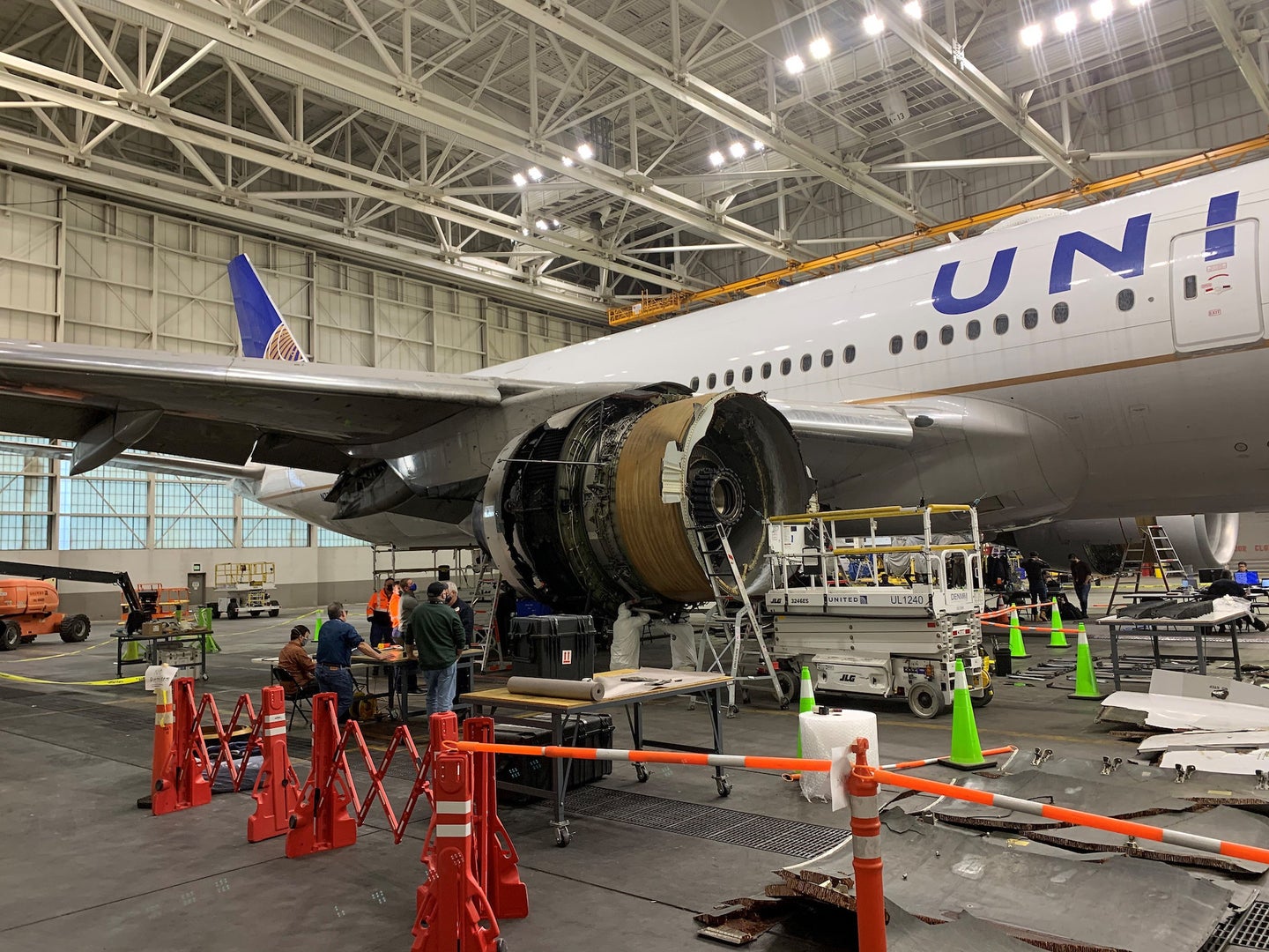 Boeing's damaged 777-200 parked in a hanger following an incident with its engine on Flight 328 on February 20.