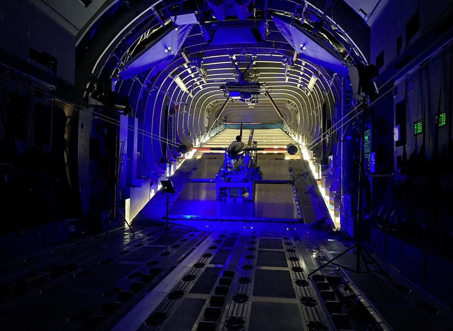 A drone in a launcher in the back of a cargo aircraft.