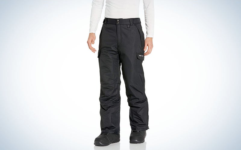 A person wearing Arctix Mens Snow Sports Cargo Pants on a plain background