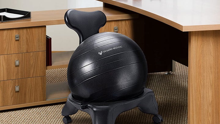 balance ball chair in an office next to a wood desk