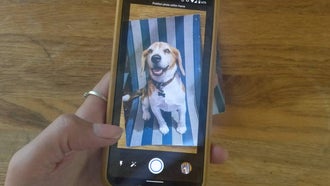 Smartphone using the app Google PhotoScan to scan a printed photo