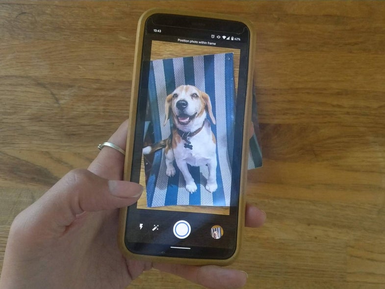 Smartphone using the app Google PhotoScan to scan a printed photo