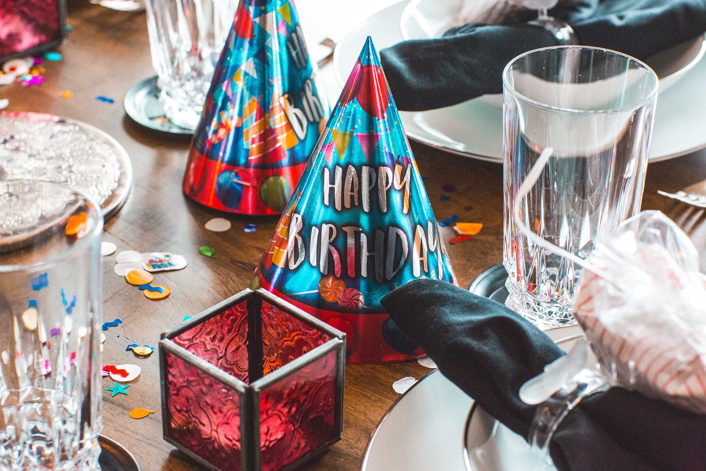table with birthday hats and other festive items