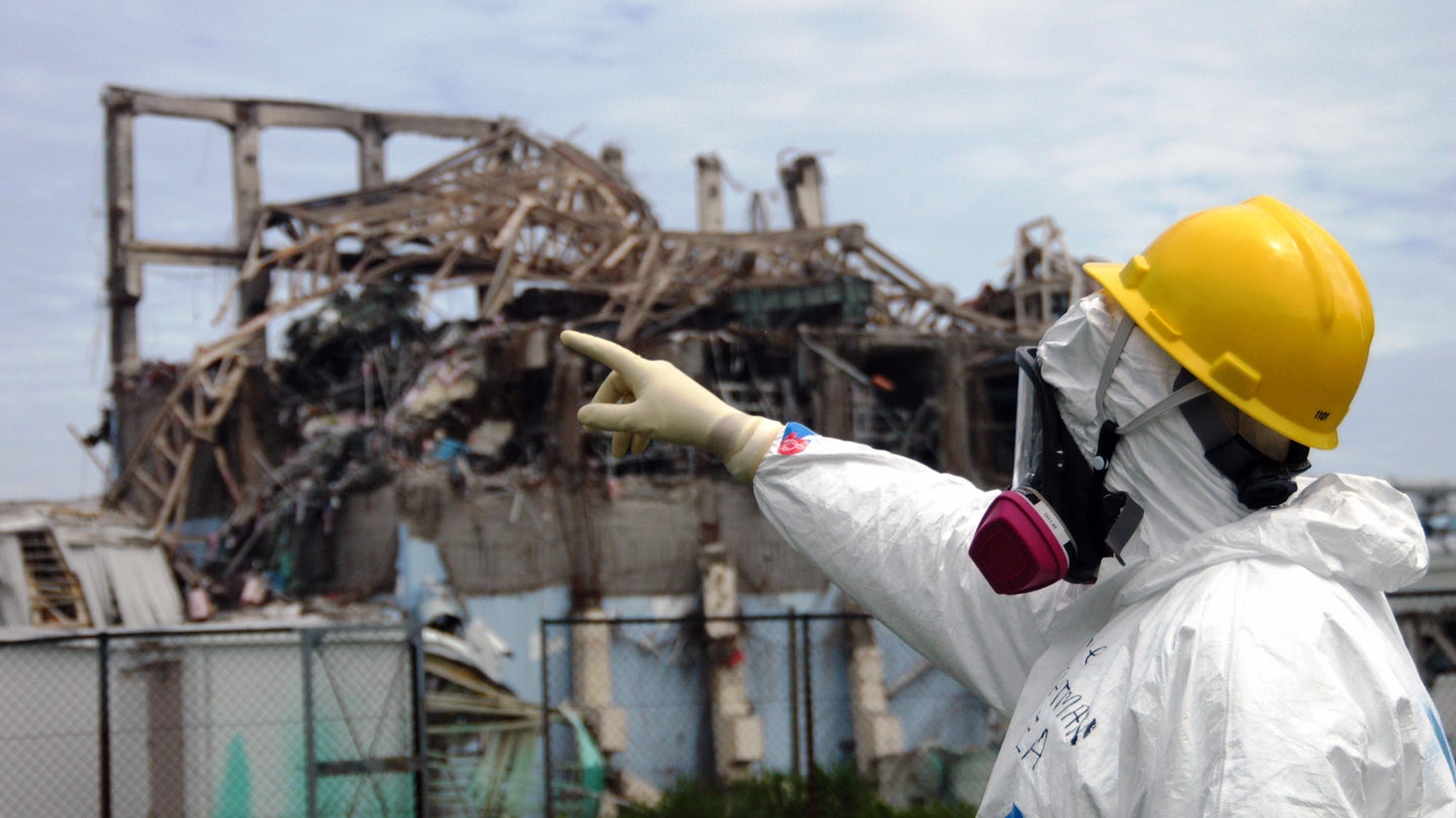 investigator examines Reactor Unit 3 at the damaged Fukushima Daiichi plant