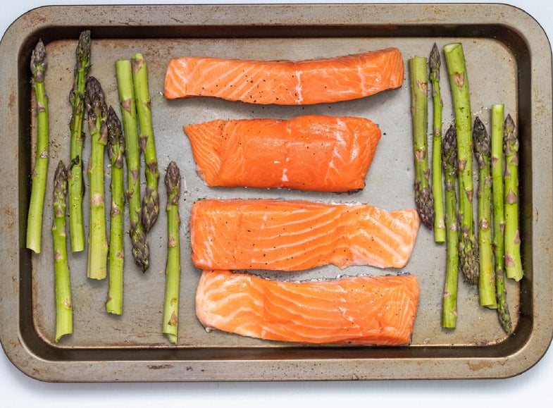 Salmon and asparagus on a cooking sheet