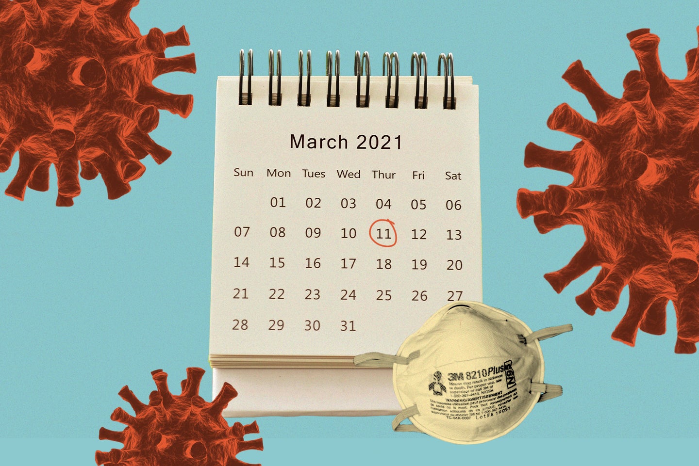 A calendar with the page for March 2021 displayed and a red circle around Thursday the 11th sits next to an N95 mask on a blue background surrounded by red illustrations of the coronavirus.