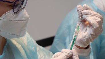 a person preparing a vaccine