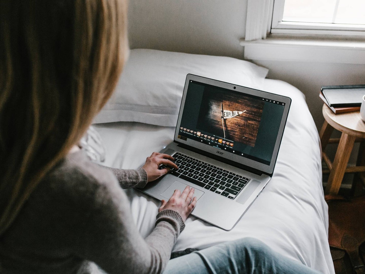 Person using a laptop in bed