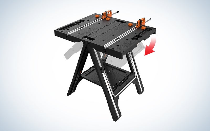 black wood workbench with orange clamps