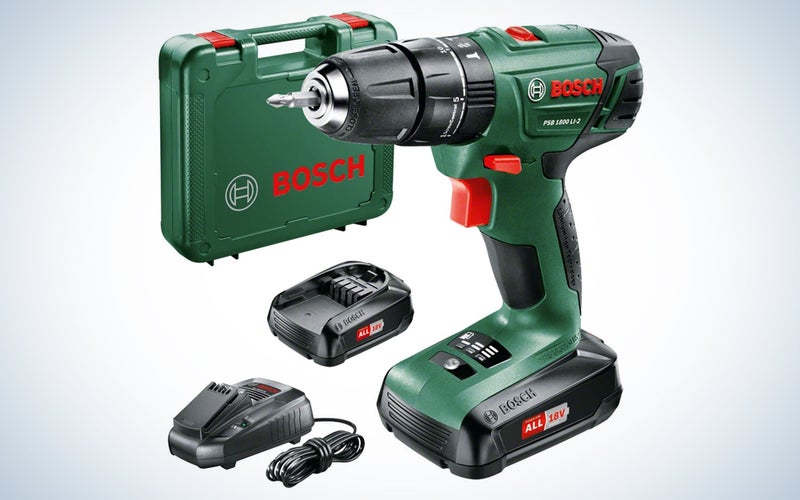 green cordless drill with battery, charger, and carrying case