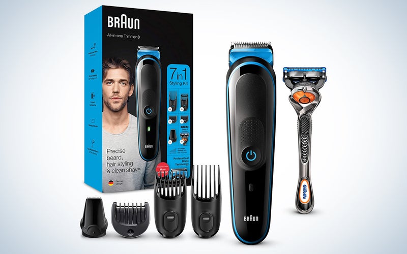 black and blue clippers with hair guards, a razor, and box