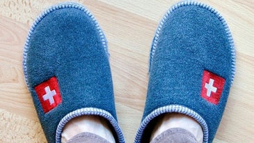 Man wearing blue slippers