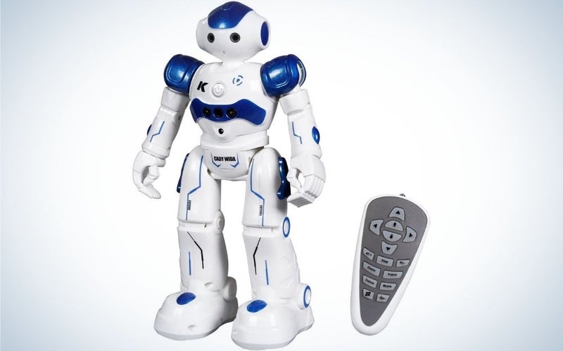 White and blue Cady Wida robot standing and a grey remote beside it.