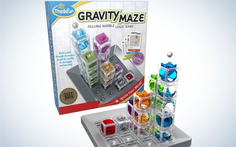 Colorful ThinkFun Gravity Maze with falling marble and logic games structured with crystal boxes and colored marbles.