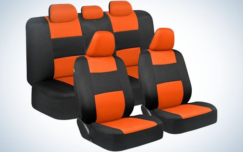 Two black and orange seats with double black and orange sets besides them.