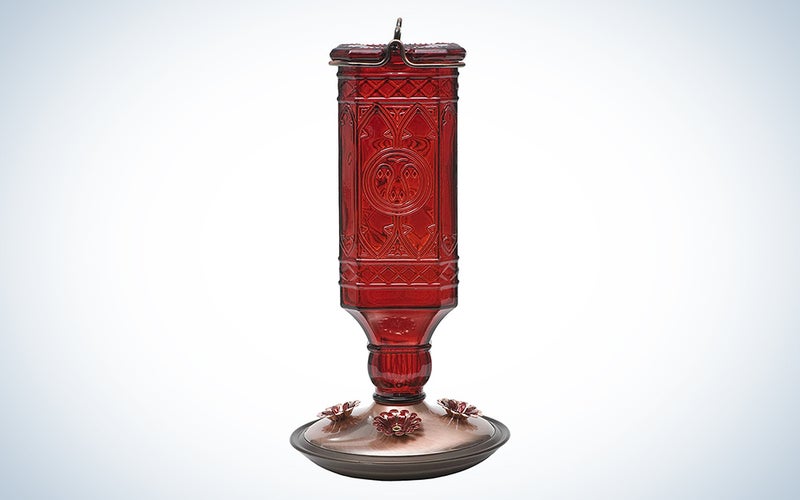 red antique glass bird feeder
