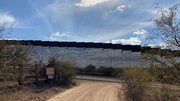 Steel beams of the border wall in the Sonoran Desert