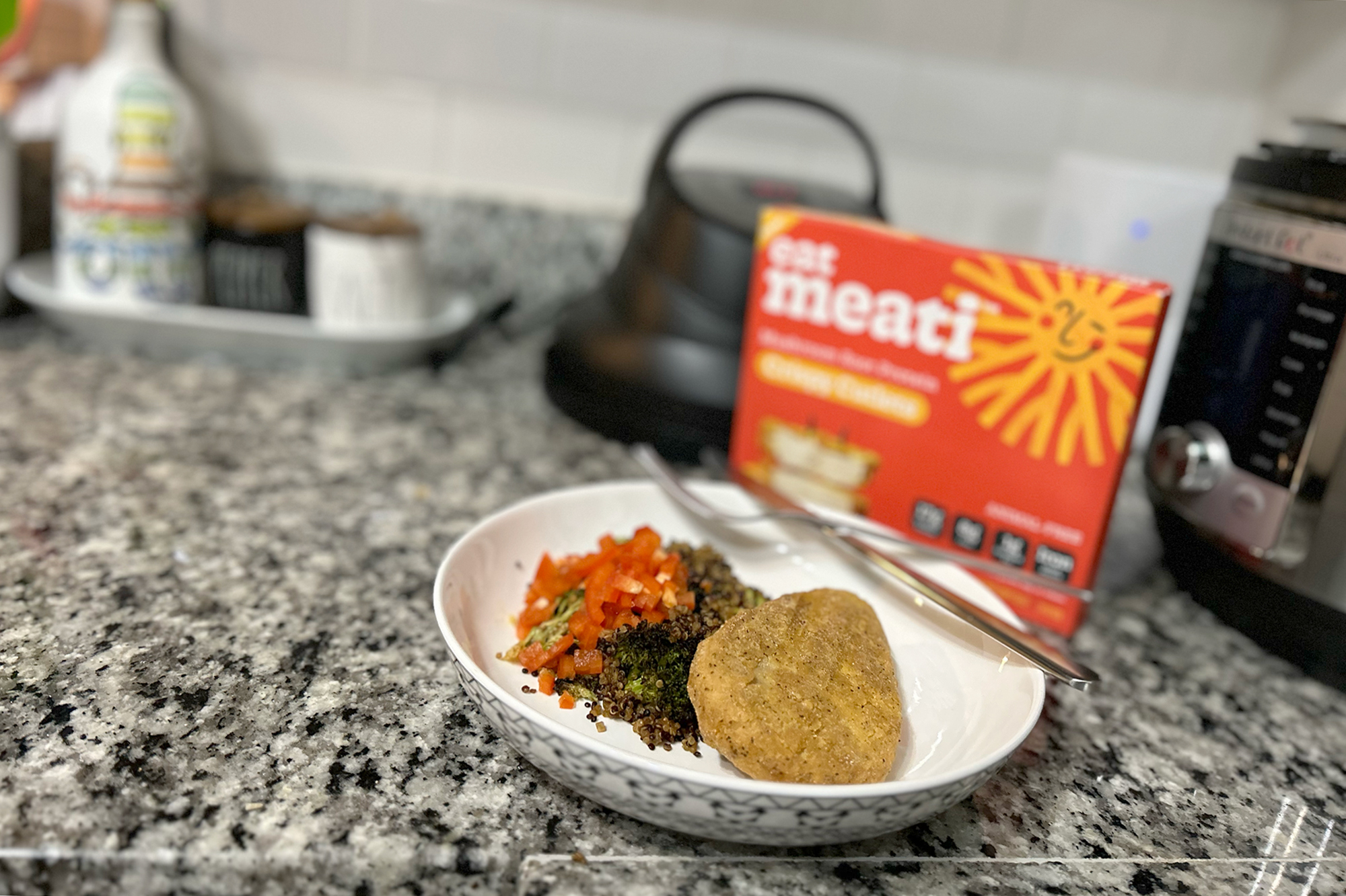 Meati chicken cutlets plated with quinoa on my counter